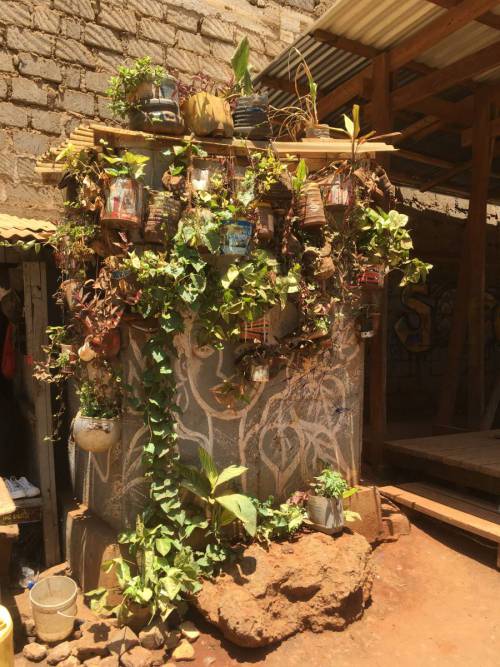 The Slum Soccer Green Wall is maintained by a local gobbler, a respected member of the community who also mentors and advises younger community members. Mlango Kubwa, February 2024. Photo Siiri Sandberg.