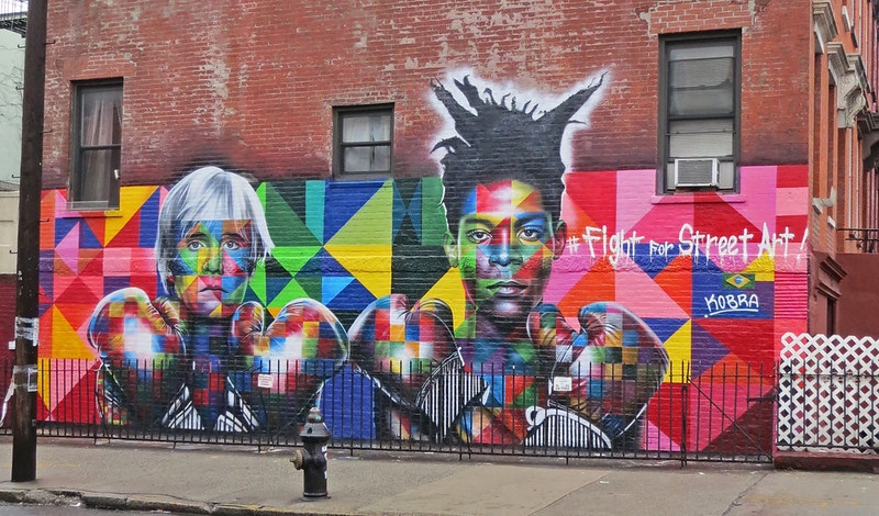 Picture of street art painting of two women with boxing gloves